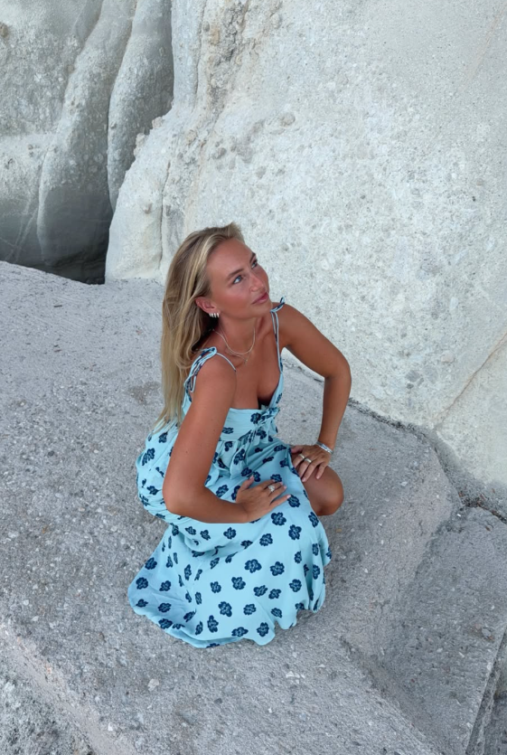 Anna698880's tweet photo. Light blue floral slip dress matches the pale rocky coastline perfectly  Flowy fabric sways gently in coastal breeze simple silver accessories add subtle elegance capturing the laid  free vibe of seaside vacation moments https://t.co/fIxpF9NzTi