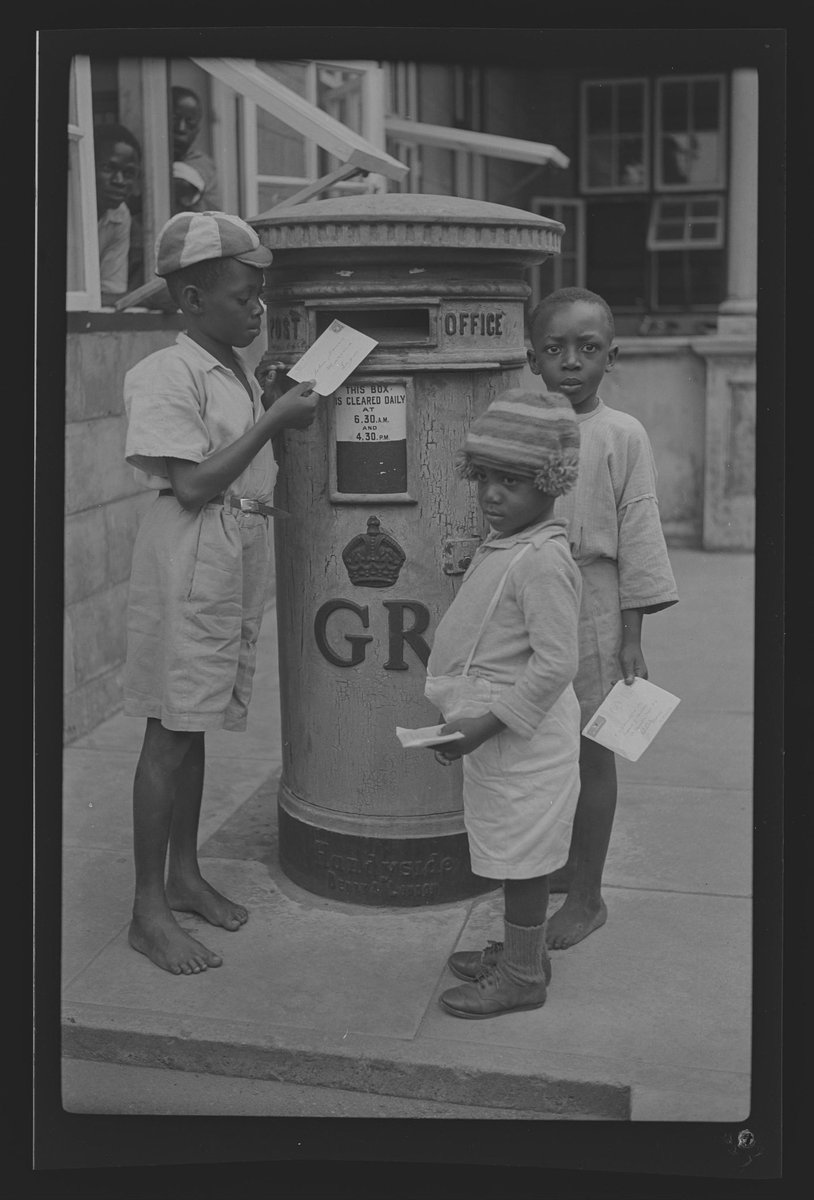 nnamdinnake's tweet photo. Our #ImageOfTheDay shows three children posting letters at a pillar box in colonial Nigeria. 

The image is undated, but the period can be discerned from the crowned symbol GR, which meant Georgius Rex, and is Latin for King George. 

This Royal Cypher (symbol) was used to indicate the reigning sovereign on official items like military insignia, government buildings, and post office boxes.