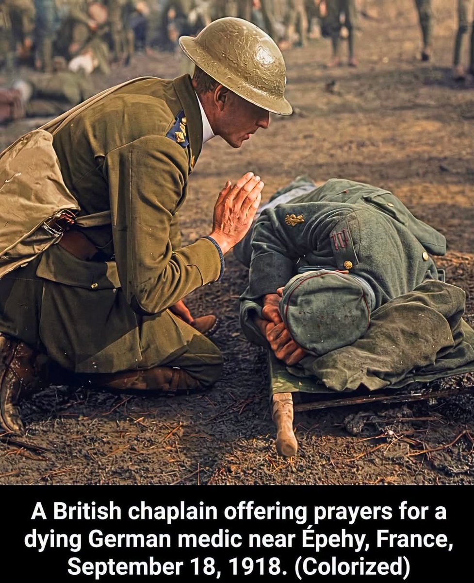 sscjusa's tweet photo. STORY CREDIT: The Historian's Den on Facebook

On September 18, 1918, during the Battle of Épehy, this moment was captured during the Allies' Hundred Days Offensive, the final, decisive push of World War I on the Western Front. Near the village of Épehy in northern France, Allied forces launched an attack against heavily fortified German outposts guarding the formidable Hindenburg Line.

Fought through grueling trench conditions and heavy artillery barrages, the operation succeeded in breaking through Germany's outer defenses, clearing the path for the major Allied offensive that ultimately forced the Armistice in November 1918.

Photographed by British official war photographer Second Lieutenant Thomas Keith Aitken (Imperial War Museum collection, item Q 11336), the image captures a poignant display of shared humanity amidst the horrors of war. Military chaplains and medical stretcher-bearers on both sides worked tirelessly under extreme peril, often exposing themselves to heavy fire to tend to the wounded and administer last rites.

Here, a British padre kneels in prayer over a fatally wounded German combat medic, illustrating how personal empathy, faith, and basic human dignity persisted even between enemy combatants during the bloodiest closing months of the conflict.