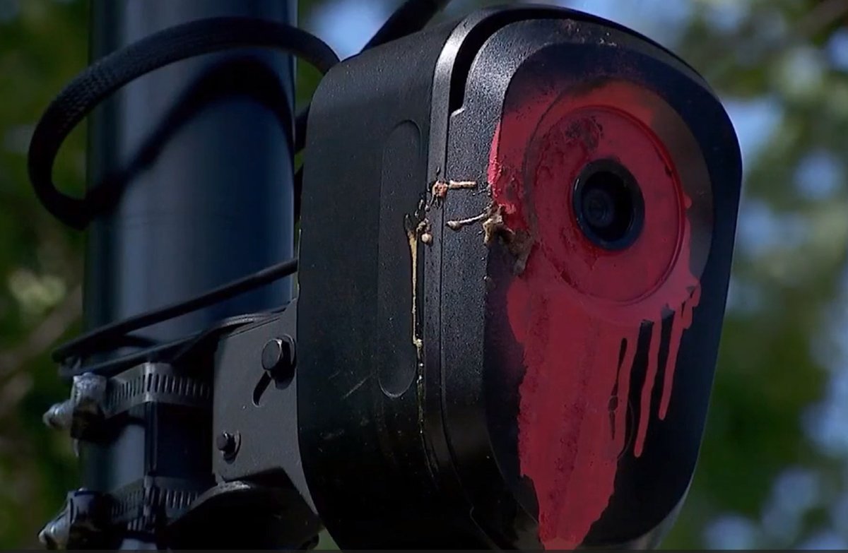 OrwellDay's tweet photo. Flock cameras have a lens protector that protects them from spray paint damage

This is a screenshot taken from a video reporting on Flock camera destruction.  Notice the black center has no spray paint on its out facing rim.  This indicates this is a lens cover sitting on top of the real lens.  When this is spray painted they simply pop the cover out and put a new cover on, like they did here in this image.

So spray painting a camera works, but it does not damage a camera permanently.  It only incapacitates the camera until someone can come out and change the lens cover.