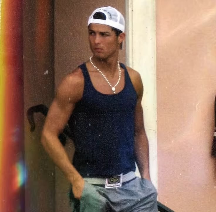 Christminespace's tweet photo. Unlocking a core memory for everyone who grew up in the late 2000s. Before the luxury billionaire suits, CR7 was the ultimate streetwear blueprint. This picture is absolute peak culture, nobody had more aura than 2008 Cristiano.The tight tank top the white D&G belt and a rosary necklace this young boy single handedly ran the summer fashion. You just had to be there.