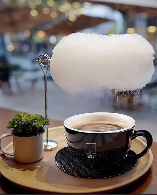Rainmaker1973's tweet photo. A coffee shop in Singapore invented the "Sweet Little Rain." 
This coffee or tea is served with a puff of cotton candy.

The steam from the coffee rises to dissolve the cotton candy, and the puff begins to "rain" onto the coffee cup. https://t.co/YhoZsZTjEP