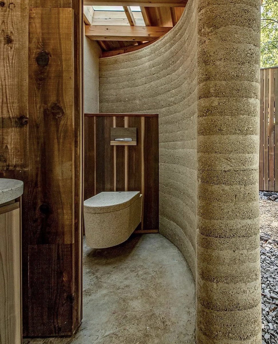 SustainableTall's tweet photo. Public toilet in a Japanese forest, built from rammed earth and timber frame. 

The foundation is made of crushed stone instead of concrete. The hand wash and toilet bowls are also made of recycled wood chips.

Tono Mirai Architects https://t.co/ZiayPEEz4a