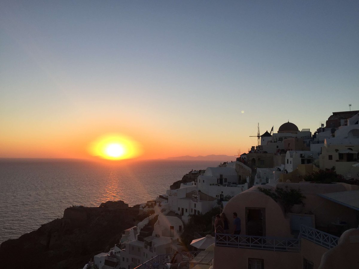 BiffRoland's tweet photo. Chased the sunset along Santorini’s white cliff paths, and watched the sky melt into tangerine and lavender. No plans, just salt air and perfect, quiet magic. ， https://t.co/yc4XtjDpQV