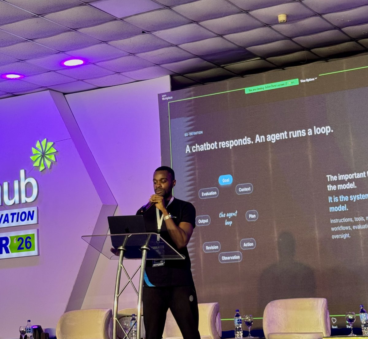 FlowResearch_'s tweet photo. A few frames from Proof of Work for the AI Age.

Julian Duru @julian__duru took the stage at the @nithub_lag innovation fair 2026 to share ideas on curiosity, building, and finding your edge in the AI age. https://t.co/UCnfifsVZQ