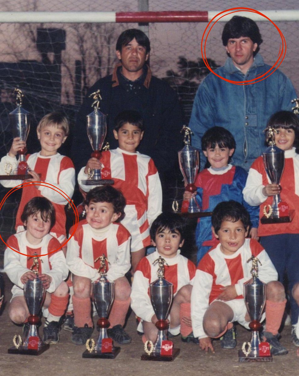 Barca_Archive's tweet photo. 5 years old Messi with his father, celebrating a trophy with his first official club, Abanderado Grandoli, 1993. https://t.co/aK1skzzMdX