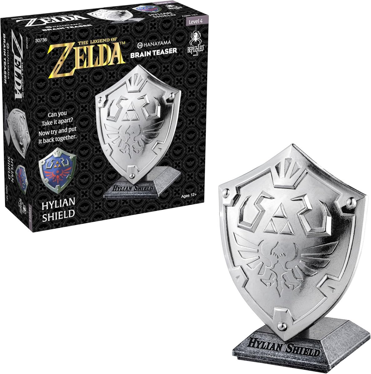 Wario64's tweet photo. Legend of Zelda Hylian Shield Hanayama Metal Brain Teaser is $17.99 on Amazon https://t.co/IHmikorVUV #ad https://t.co/A3xEOjcFB1