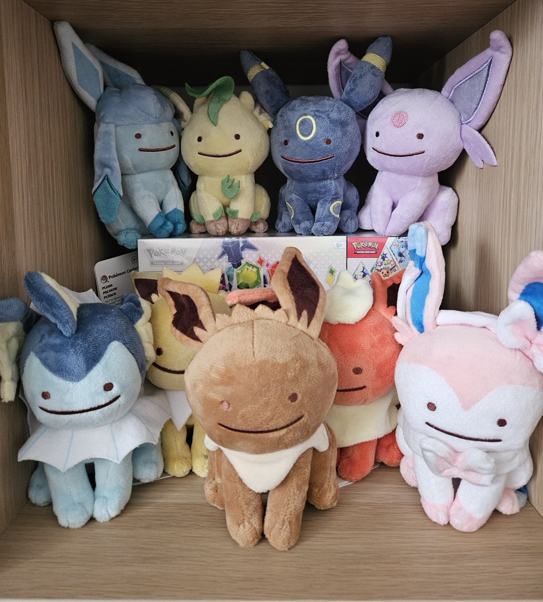 debbiepebble's tweet photo. A few months back, I decided to collect every single Ditto As Pokémon plushie. 
Currently sitting at 38/57, with +11 more I'm collecting from friends at Worlds (thank you @AnneEmmaa @luvallalways + @coupleofgaming 💖💖💖). 
Building my little shelf of happiness 😊 ✨️ https://t.co/zXvTPUzugr