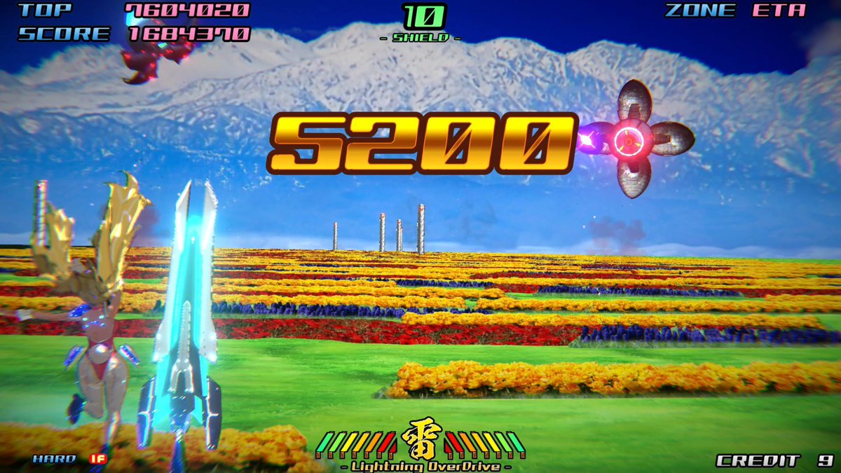 A screenshot of a retro-style shooting video game showing a score of '7604020' (top score '1684370'), zone 'ETR', with '5200' in large gold text over a colorful flower field and snow-capped mountain backdrop, with 'Lightning OverDrive' at the bottom.