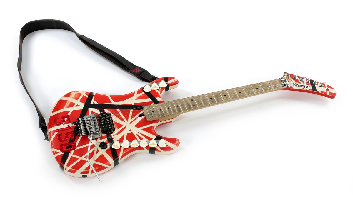 gguworld's tweet photo. A Kramer that Eddie Van Halen used in the studio, with his actual cigarette butts still wedged under the strings, just sold at auction for $170,000.

It was the first guitar his tech Zeke Clark ever built for him, from the 5150 era. https://t.co/xmQdUAZDYW