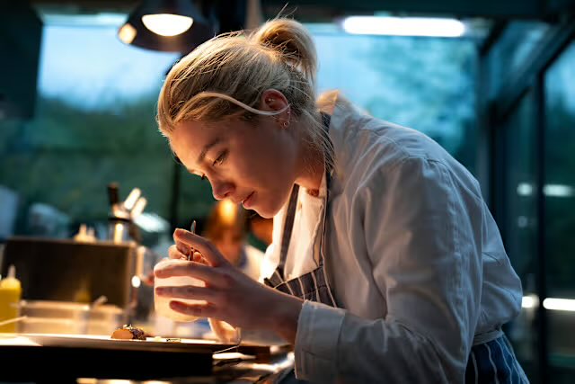 hailbishova's tweet photo. this picture of Hailee cheffing it up reminded me of this picture of Florence as Chef Almut in WLIT 😭

striped apron, hairstyle, and everything https://t.co/YCLp1WA38I