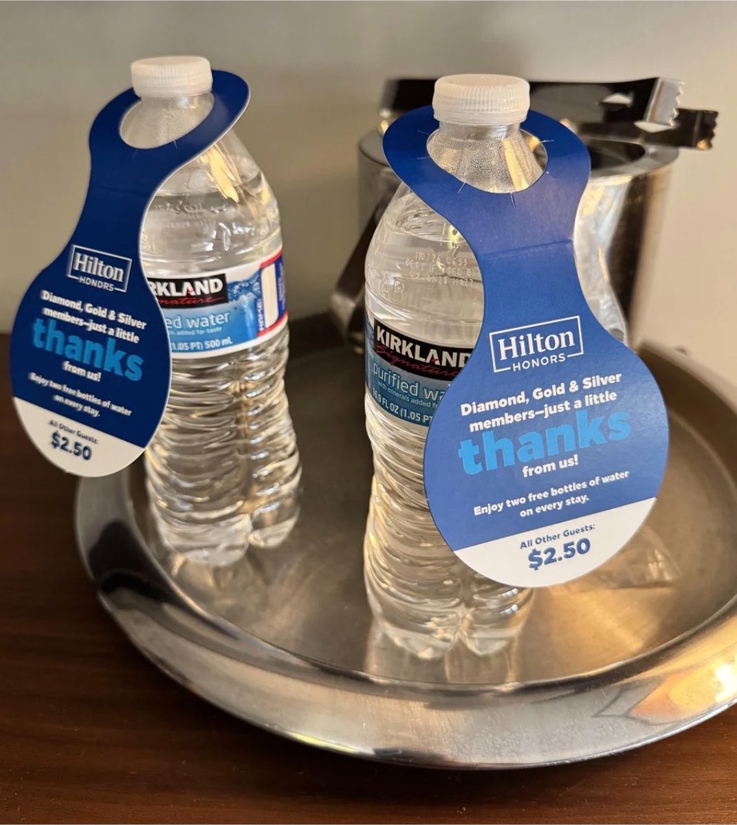 TrungTPhan's tweet photo. Hilton Hotel charging $2.50 for in-room bottles of Kirkland Signature water might be the greatest markup in the history of capitalism https://t.co/c6TKUwYbJW