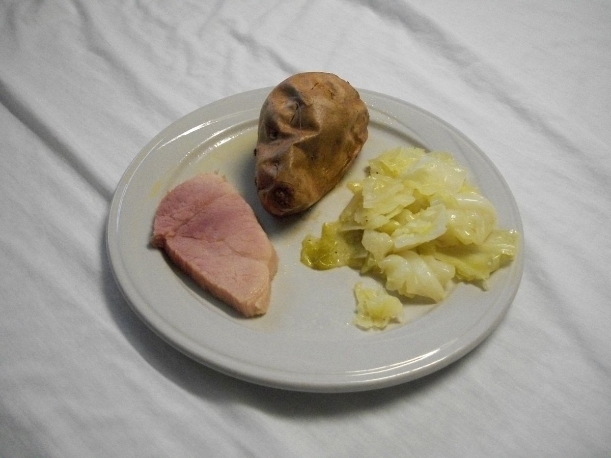 CarlBethea5's tweet photo. I live in a nursing home and this first image is a meal they served on St. Patrick's: corned beef (chewy), fried cabbage (good) and a baked sweet potato (wonderful). The 2nd image is my cooking in the microwave: tacos with braised chicken salsa and spinach.  TBF my tacos are on a smaller plate. Thank God I can cook!