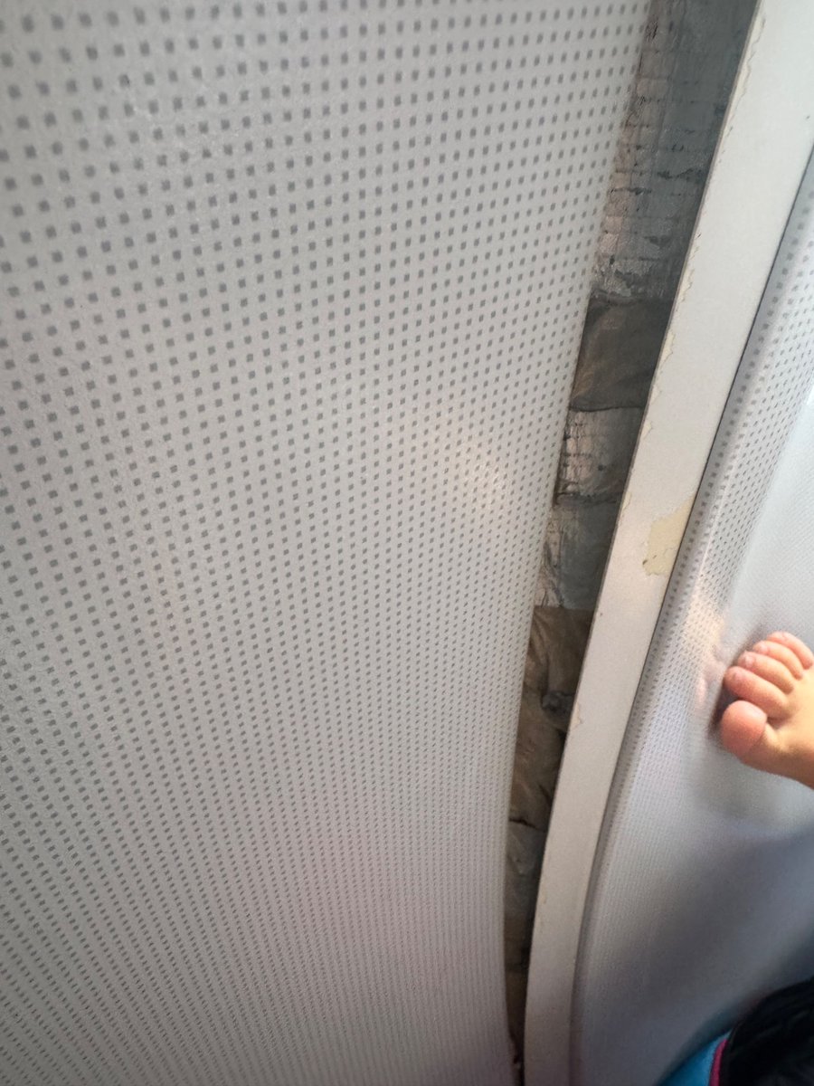 sarahdance05's tweet photo. Flight EI121 and my toddler gets her hand stuck in an aeroplane wall that’s just lying busted open. @AerLingus do better. How was this given then go ahead to board and fly? #expensiveflight https://t.co/ATB9r61tNa