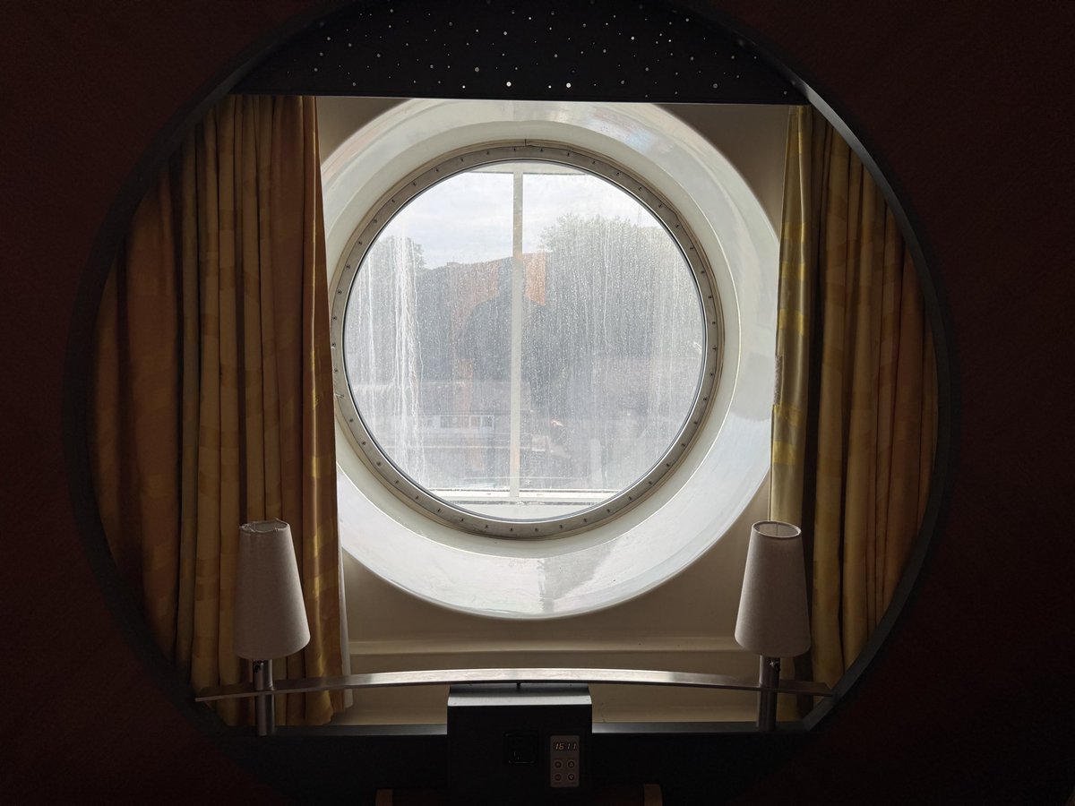 Proper_Memes's tweet photo. Holiday. We’re on a ferry and booked intentionally a cabin with a window. I’ve been on a few ferries before and I never seen a window cabin with a walking deck outside. I was happily sitting on the bog before I realised that people were walking by our window and had to close the door. 😂
