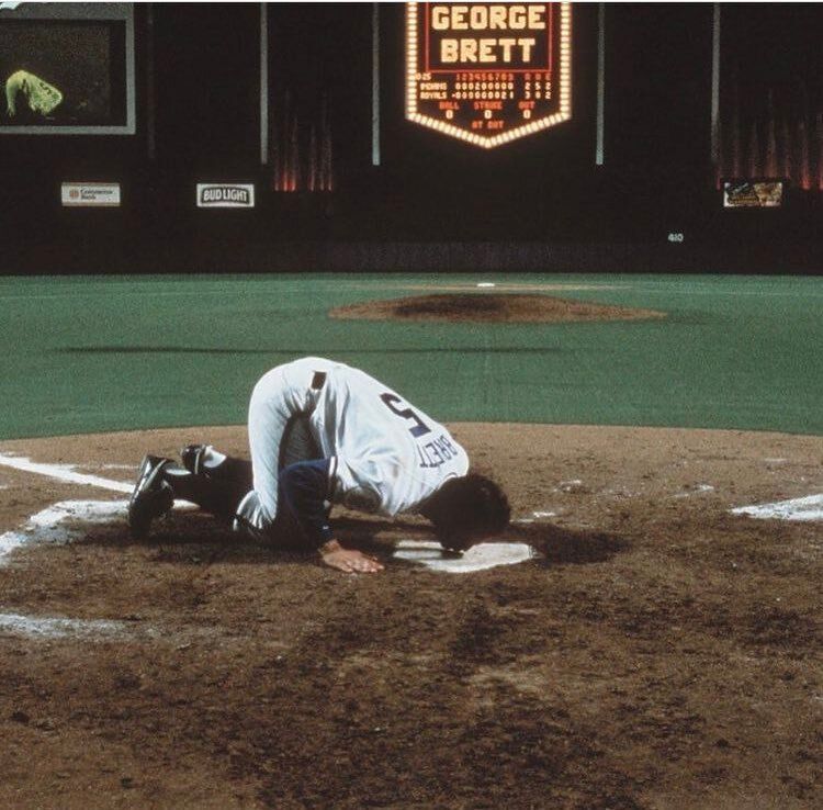 baseballinpix's tweet photo. George Brett kissing home plate at Royals Stadium after his last game there. Brett spent his entire 21 year career with the Royals, collecting 3,154 hits, 317 home runs, 1,595 RBIs, and a .305 batting average. https://t.co/6IqsMmiYxG