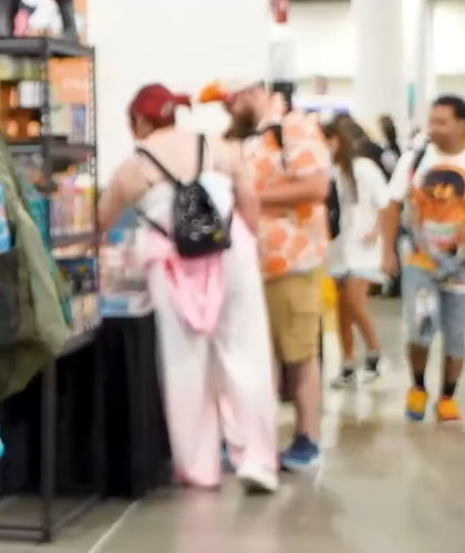 BrandonCollect's tweet photo. I recognize these two people in the background of the new RealBreakingNate video, shopping at the @Catscollecttcg booth at Card Party.. 🤔🤔 https://t.co/gOWD8wvO6k