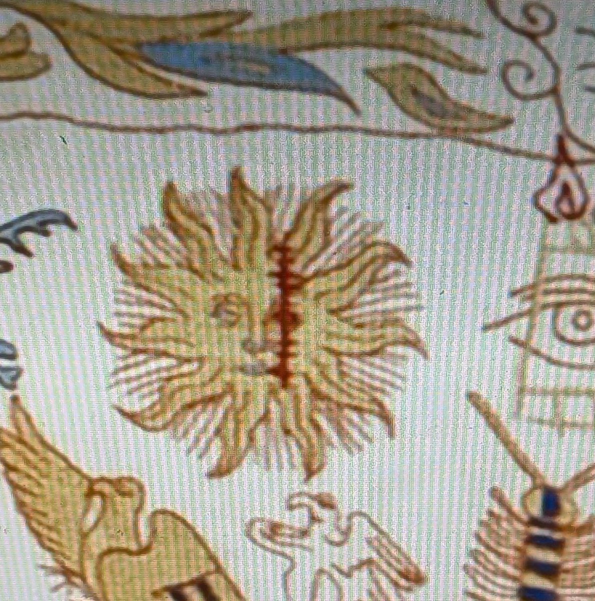 BzzzLady's tweet photo. one of the details on Helaena's tapestry being an image of the Sun with a bloody stich on the felt side of his face... I see you Aegon you are the Sun of this world https://t.co/SJjQ35q4fC