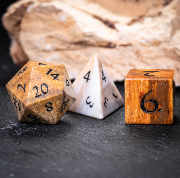 urwizards's tweet photo. These dice feel like they were carved from a forgotten age.
Petrified Wood dice with natural grain, earthy tones, and the kind of ancient magic druids probably refuse to explain.
Which set would your character carry?

#dnddice #ttrpgdice #gemstonedice #dicegoblin  #tabletoprpg https://t.co/ntogBbtH9Y