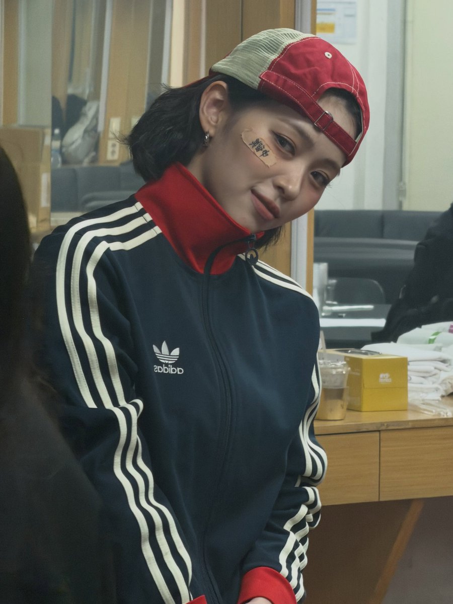 cortisshinez's tweet photo. Ryujin’s IG post update is so cute She is wearing the same Adidas jacket as JAMES studio version with a bandage on face with her name written in Chinese 😭😭🫶🏻 https://t.co/Nv7awv1MR0