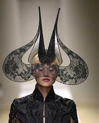 luresmagazine's tweet photo. When haute couture met the future in AW2001, Philip Treacy used molded plexiglass to frame models in a warm sci-fi aura. Championed by muse Isabella Blow, it remains an unmatched archival icon. https://t.co/nGkzWRS6FG