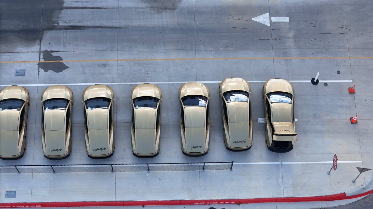 JoeTegtmeyer's tweet photo. Cybercab production over the past week or so has been noticeably very low, but today, we are seeing more starting to line up on the W side of the EOL at Giga Texas, but this time, many with the “Cybercab” logos on the doors and the hatches. 

Not sure if this indicates anything of note, but is worth keeping an eye on! I know there is a lot of interesting details in how and when these will begin to be part of the @robotaxi fleet & service, but I think we still have some time to go until that happens, but I hope its soon-ish!