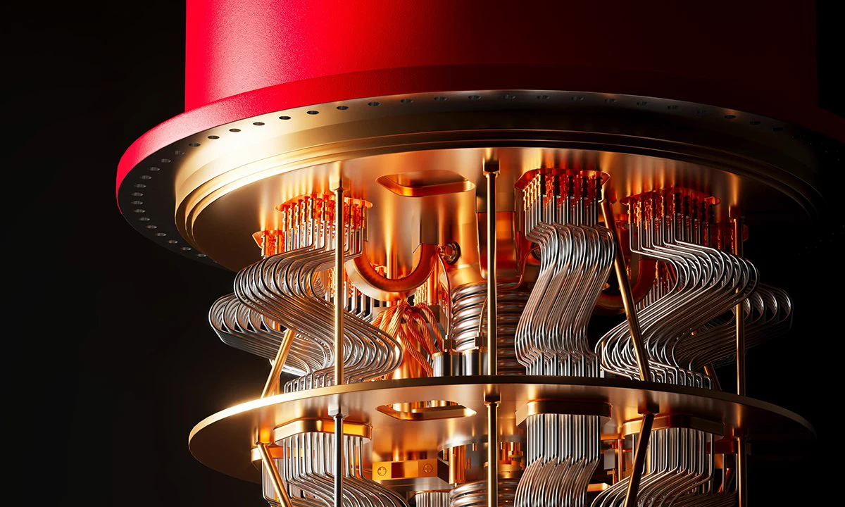 Close-up of a quantum computer's intricate copper wiring and components inside a red cylindrical casing.