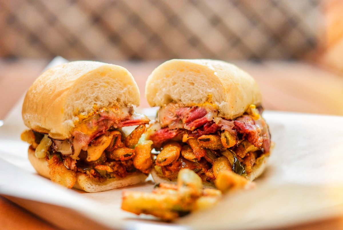 ptbbqmeats's tweet photo. J-Lo Pastrami is one of the most talked-about bites at Prime Time BBQ 😍 Thin sliced grilled pastrami on a toasted Pyreness roll with fried pickles, pepper jack cheese, and chipotle mayo brings the flavor fans crave. 🔥 #PrimeTimeBBQ #JLoPastrami #PastramiLovers https://t.co/2Yy72tOCN7