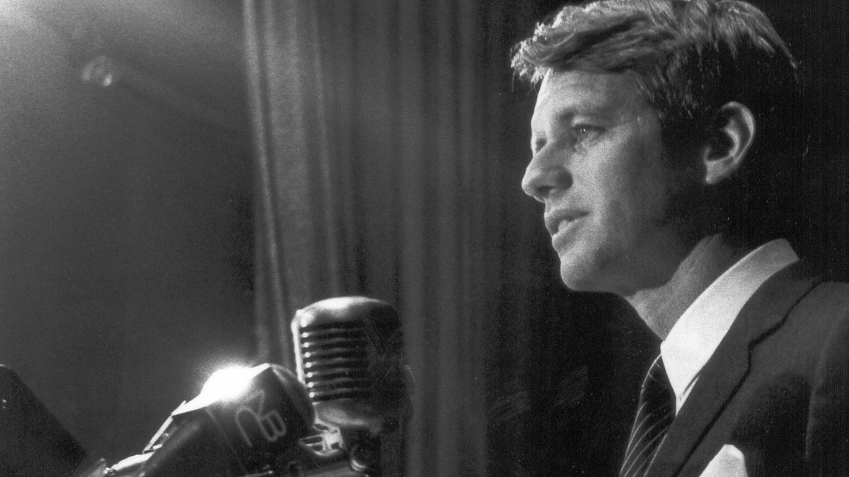 SketchesbyBoze's tweet photo. On the evening of April 04, 1968, Robert F. Kennedy was headed to Indianapolis for a scheduled speech when he learned that MLK had been killed. Kennedy now had the job of breaking the terrible news to 2,500 supporters. The speech he gave that night, improvised, is believed to have prevented mass rioting in the city. In it he spoke for the first time publicly about his brother’s death five years before, and then quoted, from memory, these words from “Agamemnon,” by the ancient Greek playwright Aeschylus:

“Even in our sleep, pain which cannot forget falls drop by drop upon the heart until, in our own despair, against our will, comes wisdom by the awful grace of God.”

It’s difficult to imagine a politician, or indeed any public figure, speaking with such intelligence and decorum today.
