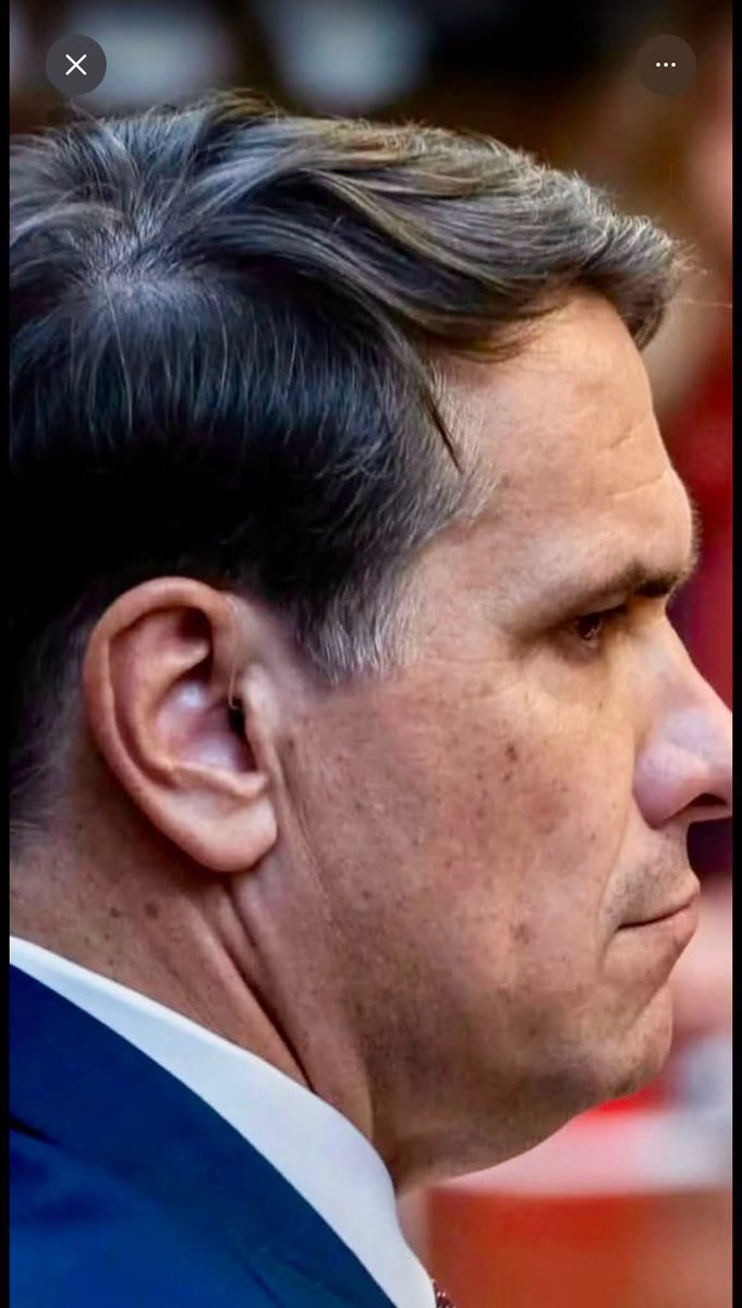 RadarResist's tweet photo. This photo is from Todd Blanche‘s confirmation hearing with the Senate. 
Zoom in, what is that wire in his ear? ￼ https://t.co/aoecpKHjnj