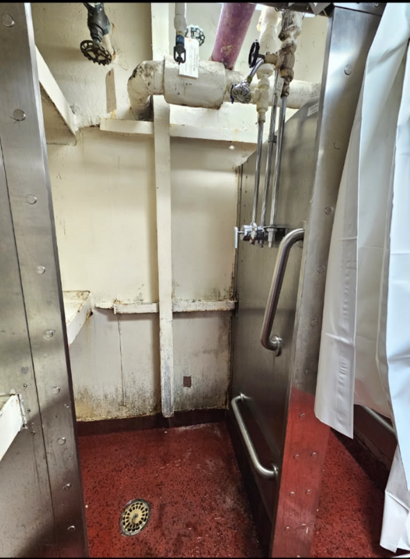 sethharpesq's tweet photo. The showers on a US Navy aircraft carrier deployed to Iran. The USA deindustrialized and closed most of its shipyards ages ago, under Reagan-era austerity measures. Now the few remaining shipbuilders charge obscenely inflated monopoly prices to keep these old rust buckets afloat. https://t.co/4ur7uYPAY4
