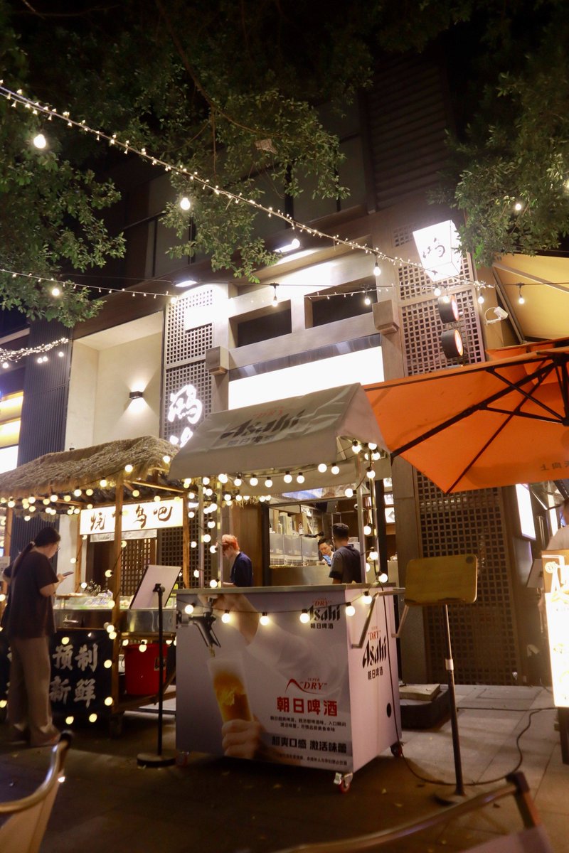 Le_Nono_'s tweet photo. [Rainy alley corner, neon sign flickering above a steaming street food cart—city’s quiet glow hits different when it pours.]， https://t.co/3TXSsz7x8K
