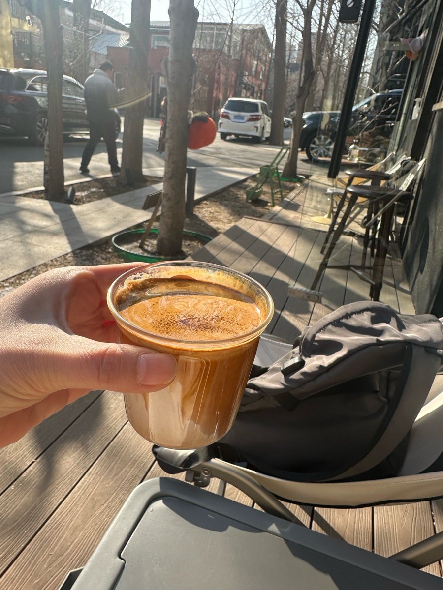 Frimousse81's tweet photo. Spontaneous street snap: A barista handing a warm coffee to a smiling regular under golden sunset glow. Small, cozy moments make the day. https://t.co/VQagn3XjtL