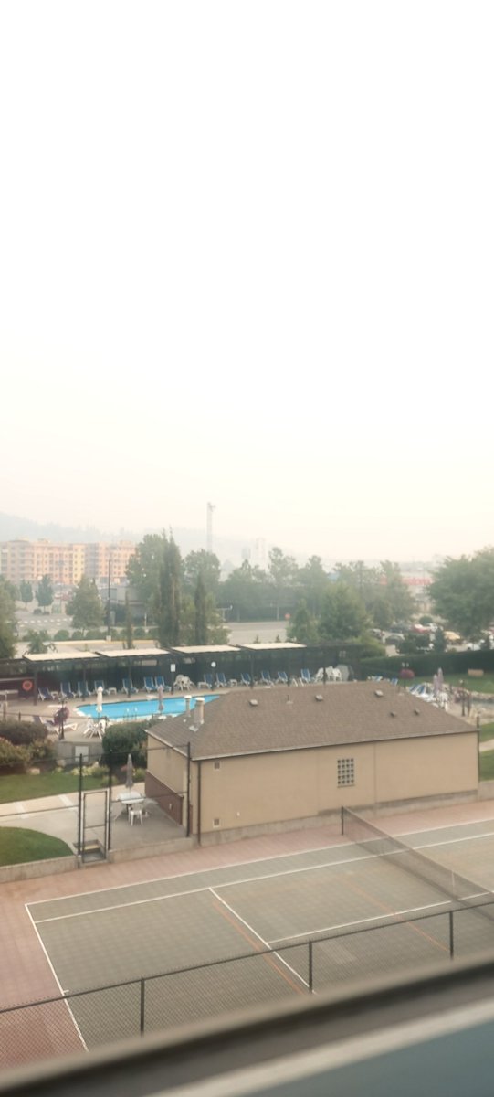 MarrandaRyujin's tweet photo. Smoky as hell here in the Okanagan. AC with a vent to outside causing it to smell like a campfire as I sleep. Watching the wildfire map to make sure we won't be evacuated. Safe so far but time will tell. https://t.co/EE7Mrnd5WV