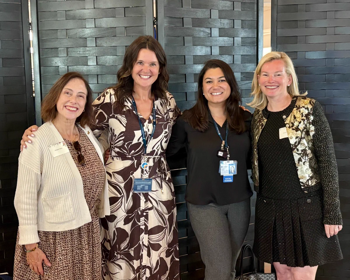 Members of Walk Team All in for Accessibility stand side-by-side while at a 2025 Dana-Farber Volunteer Services Dinner. Pictured left to right: Margaret Stein, Lindsay Bliznik, Melissa Levin, and Susan Herlihy.