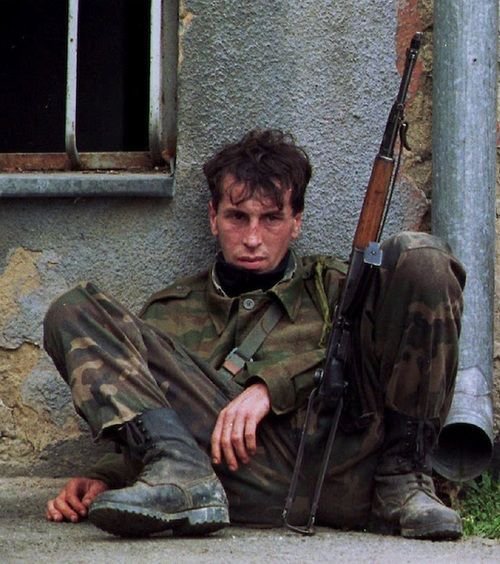 YugoslavVisuals's tweet photo. An exhausted Bosnian soldier in Sanski Most, 1995. https://t.co/XqfnOeEn1O
