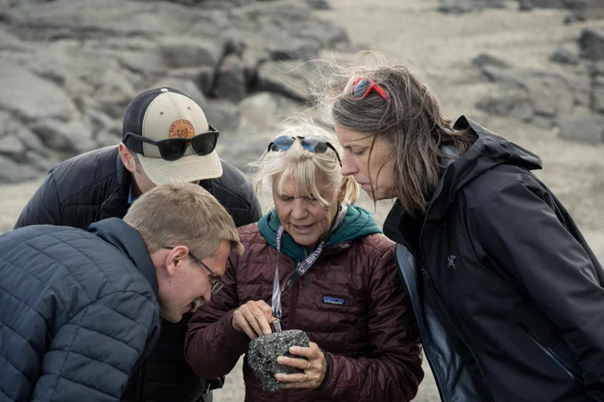 From left, Bryce Prescott, NASA astronaut candidate Cameron Jones, Artemis geology training lead Cindy Evans, and Artemis curation lead Juliane Gross, examine a rock during a geology field training in Iceland. Credit: NASA/James Blair