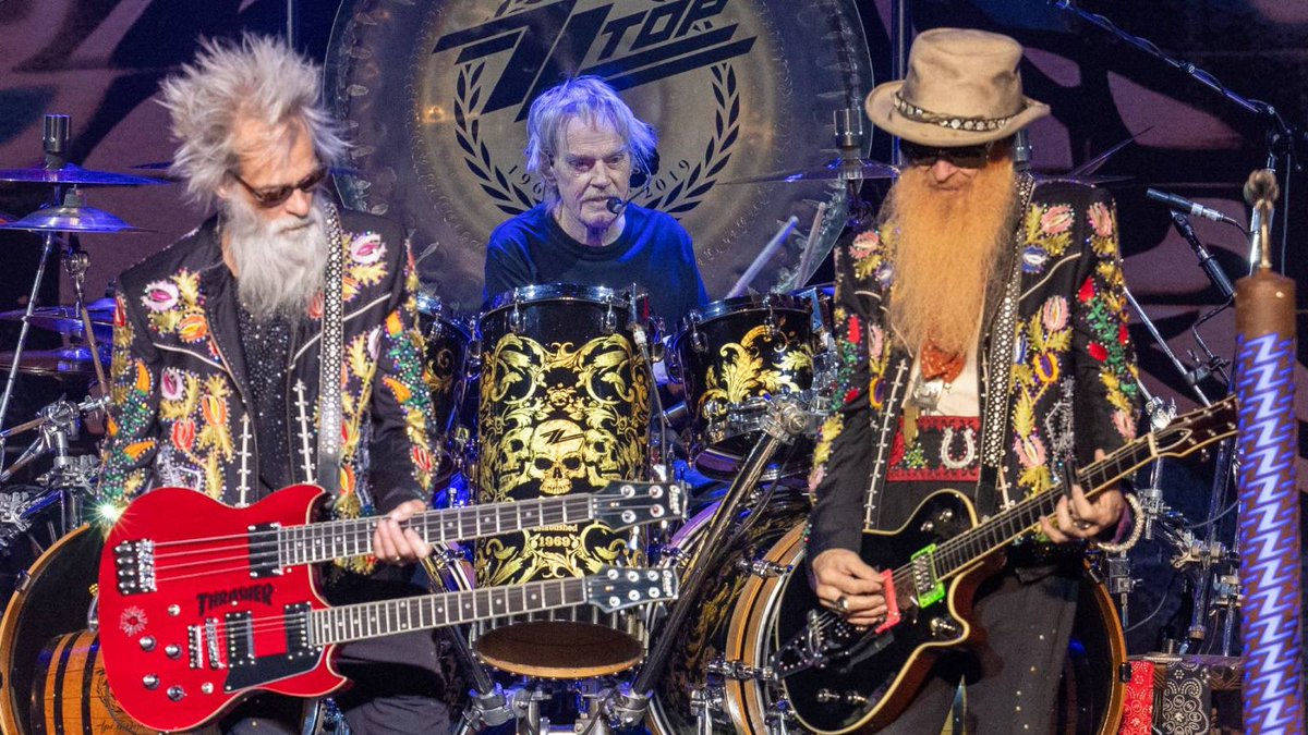 GDLevS's tweet photo. ZZ Top pulled its Aug 5 Hollywood Bowl show - Billy Gibbons cited 'insurmountable obstacles' before the band confirmed it's Frank Beard's health. He's ZZ Top's original drummer since 1969, now 77, and stand-in Michael Monahan is finishing the tour in his place. https://t.co/ZBUDy13mrB