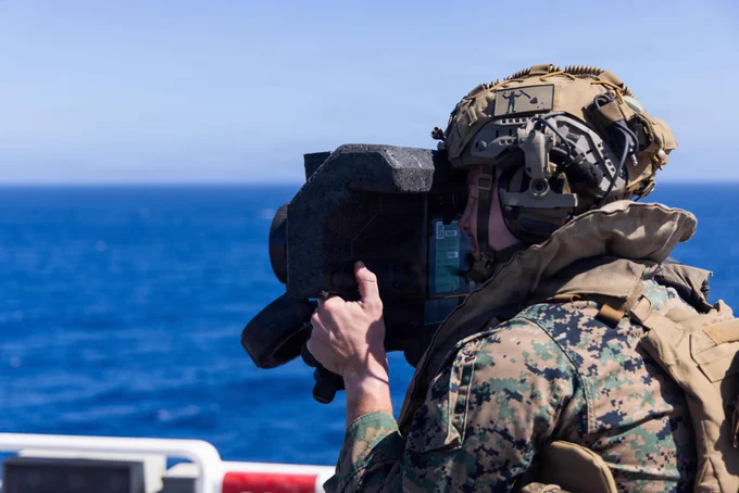 U.S. Marine Corps Cpl. Liam Hopkins, an antitank missile gunner assigned to Battalion Landing Team 2/4, 13th Marine Expeditionary Unit, observes the forward path using a command watch unit during defense of the amphibious task force training aboard Wasp-class amphibious assault ship USS Makin Island (LHD 8) off the coast of California, July 23, 2026. The 13th MEU and the Makin Island Amphibious Ready Group are underway and conducting routine operations in the U.S. 3rd Fleet area of operations to enhance their combined Navy-Marine Corps readiness and lethality. (U.S. Marine Corps photo by Lance Cpl. Fernando Cruz Martinez)