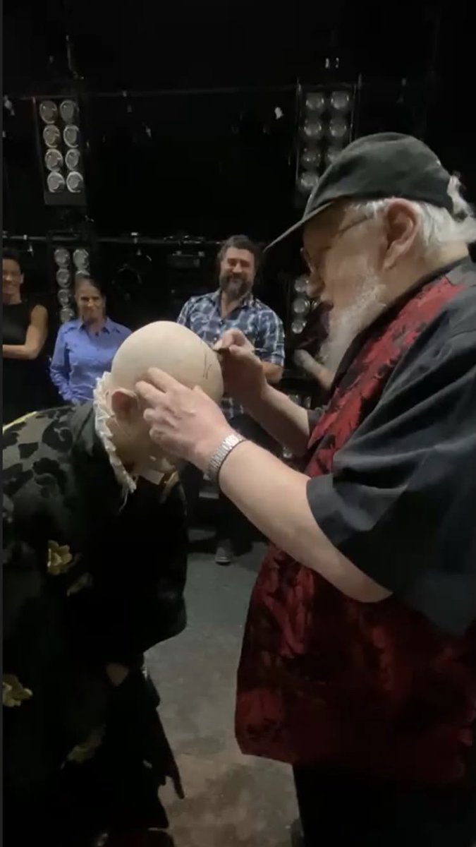 got_onstage's tweet photo. 📲 Hughie O’Donnell (Lord Varys) just uploaded these photos to his IG stories, of GRRM meeting the cast backstage, and signing his bald cap! 🧑🏼‍🦲🕷️

📸 hughie.od via IG stories https://t.co/Je1izkSPTv