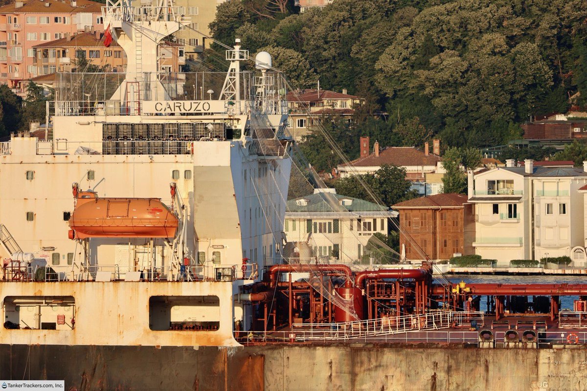 TankerTrackers's tweet photo. EXCLUSIVE: The 28-year-old Suezmax tanker CARUZO (IMO 9137648), which is under UK, EU, New Zealand, Canadian, Swiss, and Australian sanctions (but not US sanctions), sailed past us in Istanbul carrying one million barrels of Russian crude oil.

The first thing we noticed was that the crew had covered the superstructure with netting and boxed themselves in, apparently out of fear of Ukrainian drone strikes. The aft half of the vessel also appears to have additional protection in the form of cages dangling off the sides, intended to guard the engine room against attacks by sea drones.

The fear is real.

#OOTT #UkraineWar #Tankers