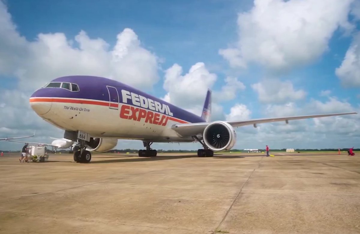 airwaysmagazine's tweet photo. 🔴 FedEx has unveiled a retro livery on Boeing 777F N884FD, named “Rosie” after founder Frederick W. Smith’s granddaughter. The design recreates Federal Express’ original 1973 livery. N884FD was among the first aircraft to land at newly renamed Frederick W. Smith Intl Airport. https://t.co/eH1vt5i85R
