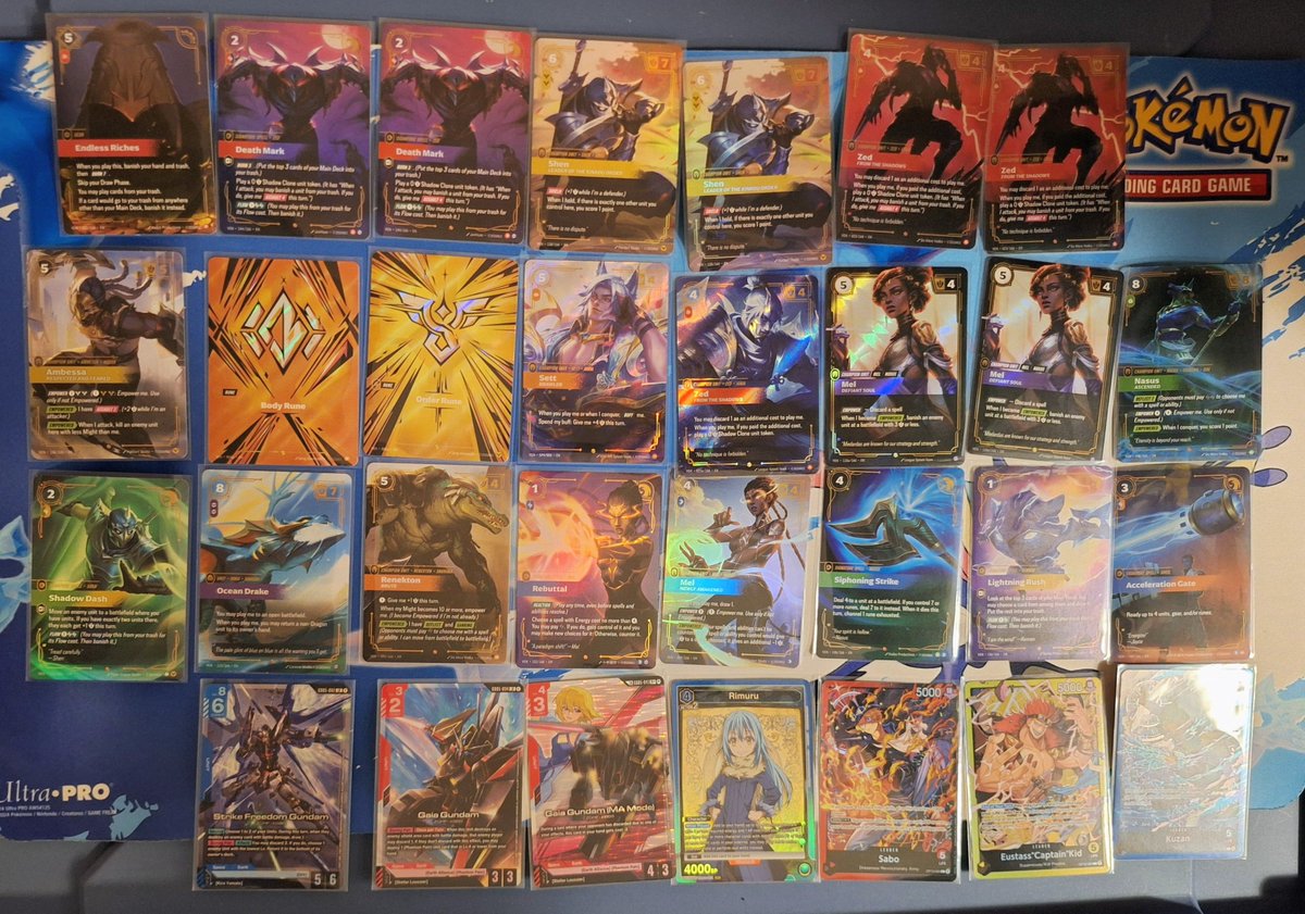 BarkerMoose's tweet photo. Opening results from the last few days!  Finally pulled an overnumbered from Vendetta tonight after opening what seemed like a ton of packs.  Plus got some good pulls from other TCGs to add a little variety to the collection. https://t.co/RFy2w2sLwO