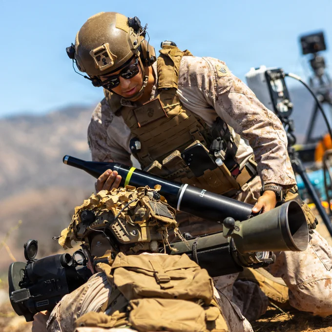 U.S. Marine Corps Sgt. Johnrene Salas, a combat instructor with Alpha Company, Infantry Training Battalion, School of Infantry - West, loads a CA41 anti-structural munition round into a Multi-Role Anti-Armor Anti-Personnel Weapon System during a field data analysis with Expeditionary Systems Engineering Division, Naval Sea Systems Command at Marine Corps Base Camp Pendleton, California, July 28, 2026. ESED used high-speed imagery and shooting chronographs to gather essential data on each type of munition to evaluate weapon performance and inform future Marine Corps training and operational employment. (U.S. Marine Corps photo by Cpl. Noah Martinez)