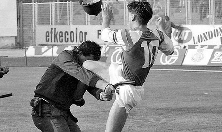 YugoslavVisuals's tweet photo. Dinamo Zagreb captain Zvonimir Boban leaping to kick a Yugoslav militia officer during the Dinamo–Red Star riot at Maksimir Stadium on May 13, 1990. https://t.co/G2TUoUXzB9