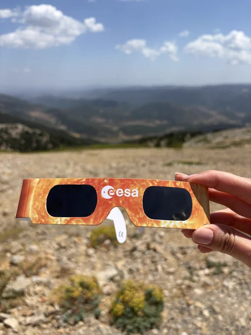 ESA eclipse glasses against the Javalambre landscape.