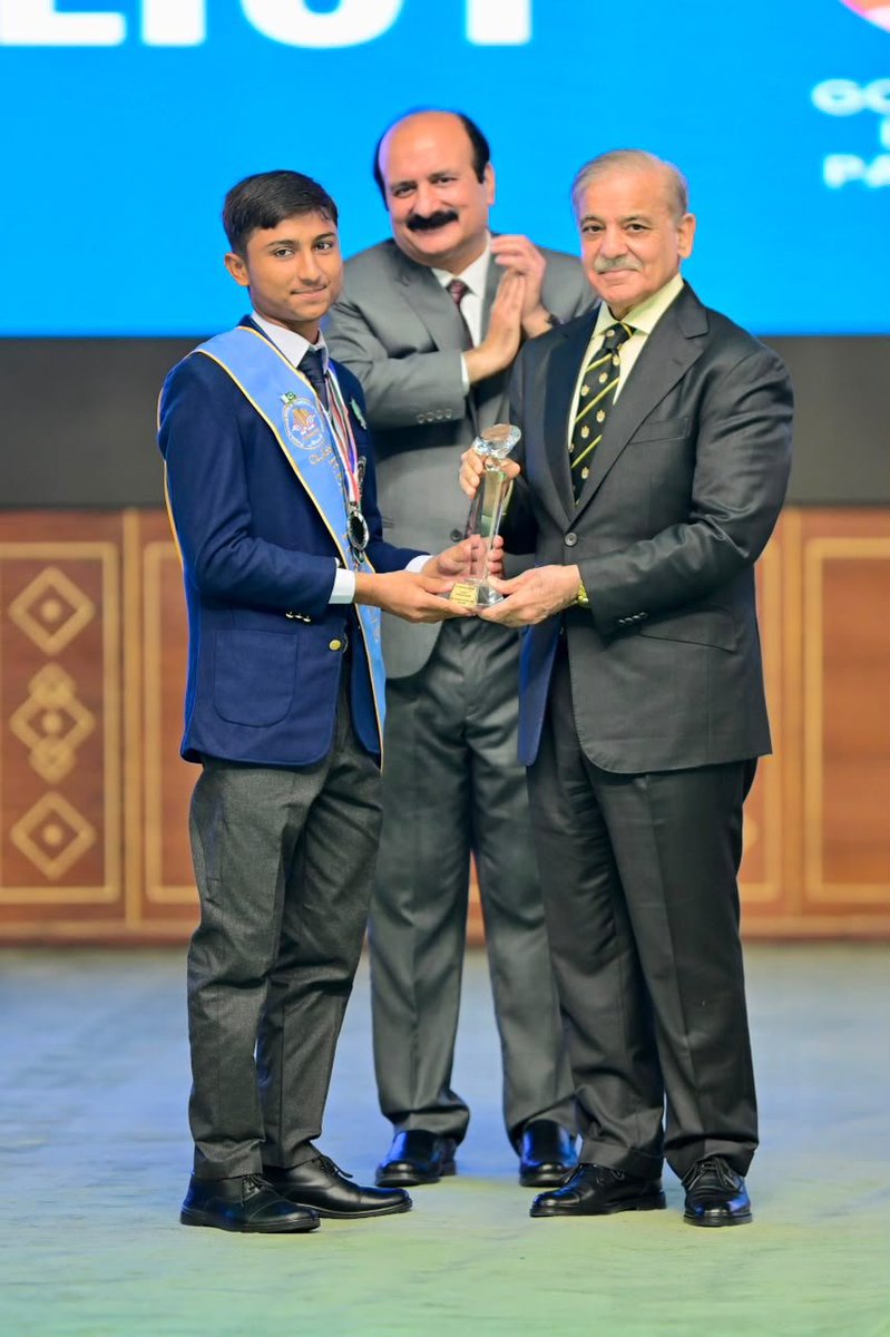 PakPMO's tweet photo. Prime Minister Muhammad Shehbaz Sharif commended Muhammad Qasim, a talented student of Danish School Fazilpur, and presented him with an award for securing first position in the Science Group and second position overall in the SSC Part-II examinations conducted by the Board of Intermediate and Secondary Education Lahore. Islamabad, 12 August 2026.