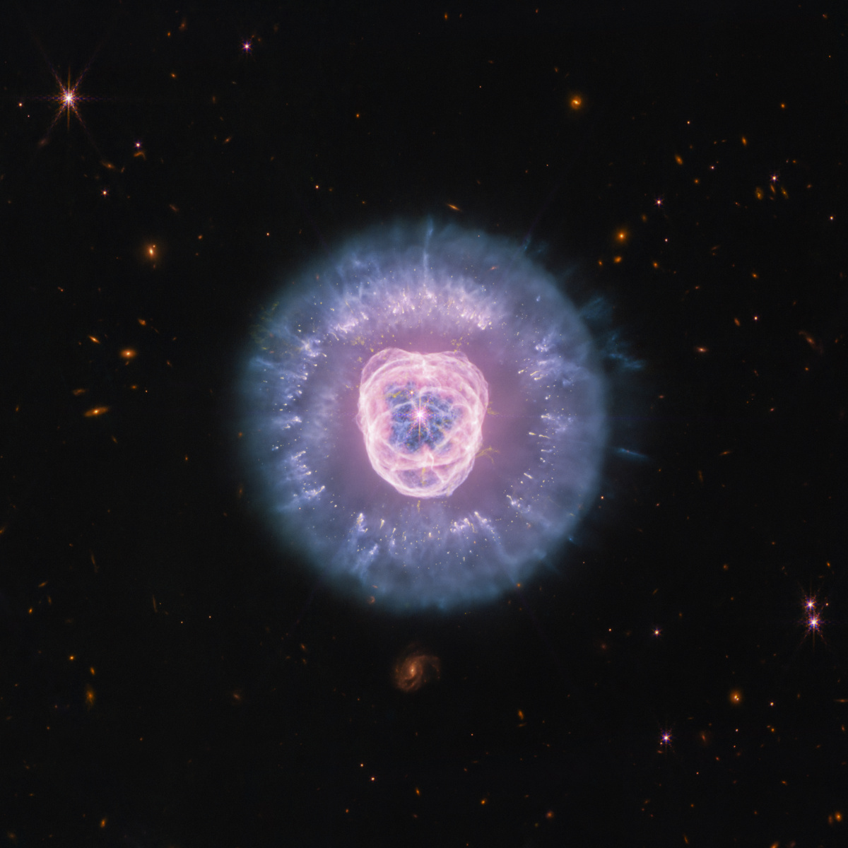 SpaceTelescope's tweet photo. It’s the circle of life and it moves us all—even stars. (Also, Pumbaa was right, stars ARE balls of gas burning billions of miles away.)

#NASAWebb has taken new images of planetary nebula NGC 2392, nicknamed the Lion Nebula, in high-resolution near- and mid-infrared. (1/7) 🧵 https://t.co/f2gYhLuK6U