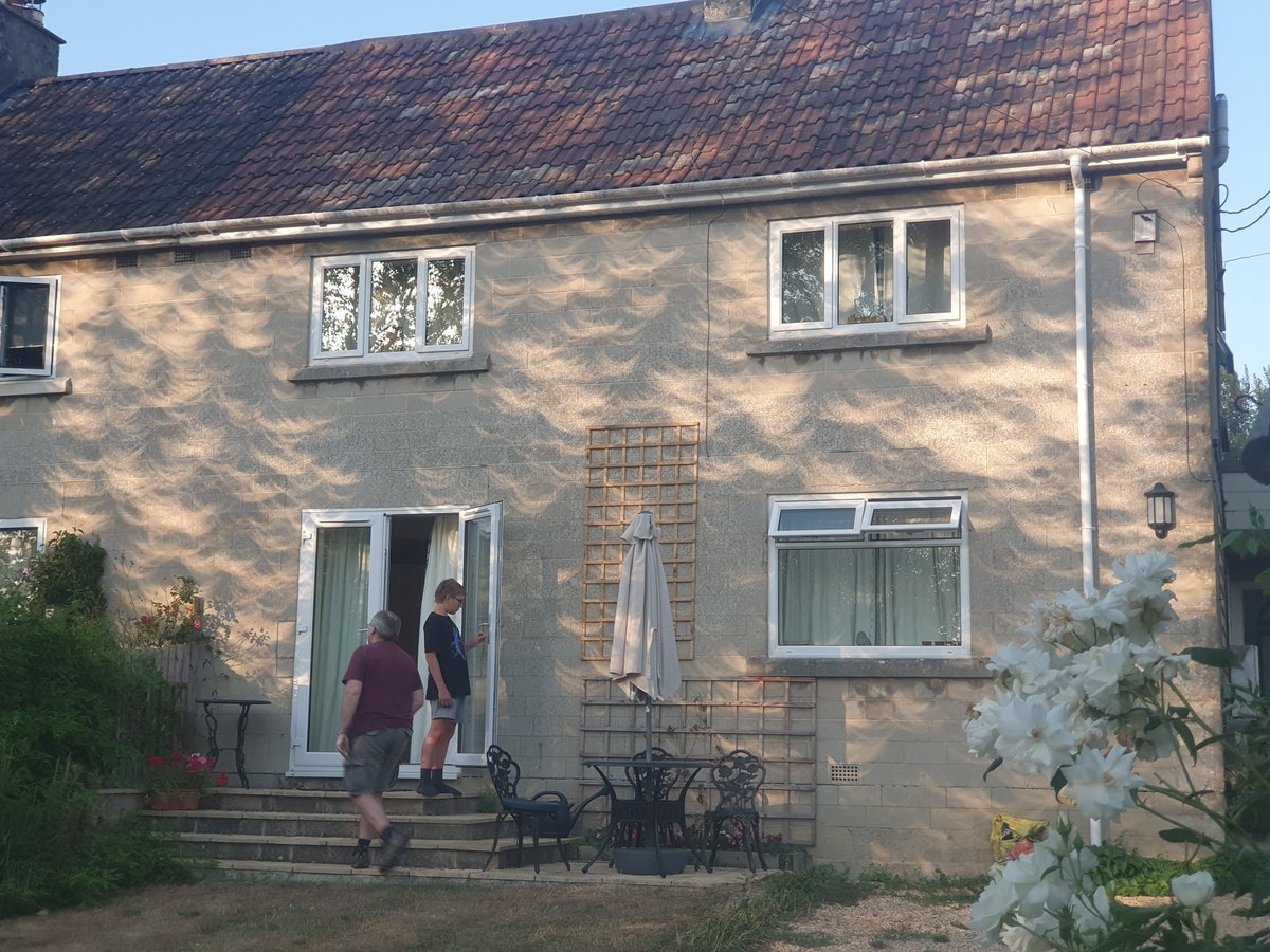 NABurkinshaw's tweet photo. The eclipse has made the most beautiful shadows from the sycamore tree on our house. https://t.co/vU7JyRaaE1