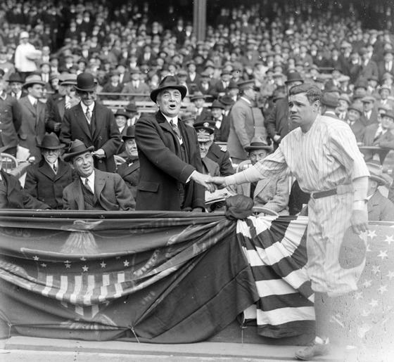 Jimfrombaseball's tweet photo. "The grand tier and the bleachers were packed to suffocation, and thousands were turned away.
It was a magnificent spectacle, a-glitter with color and vibrant with the spirit of, 'Opening Day.'"
"The New York Evening World."
"This isn't a ballpark;
It's a colossal arena fit for the gods of sport."
John Philip Sousa.
First game played at Yankee Stadium.
April 18, 1923.
President Warren G. Harding shakes hands with a thrilled Babe Ruth before the game, which was played against the Boston Red Sox in front of a crowd of more than 74,000 people.
"The House That Ruth Built."